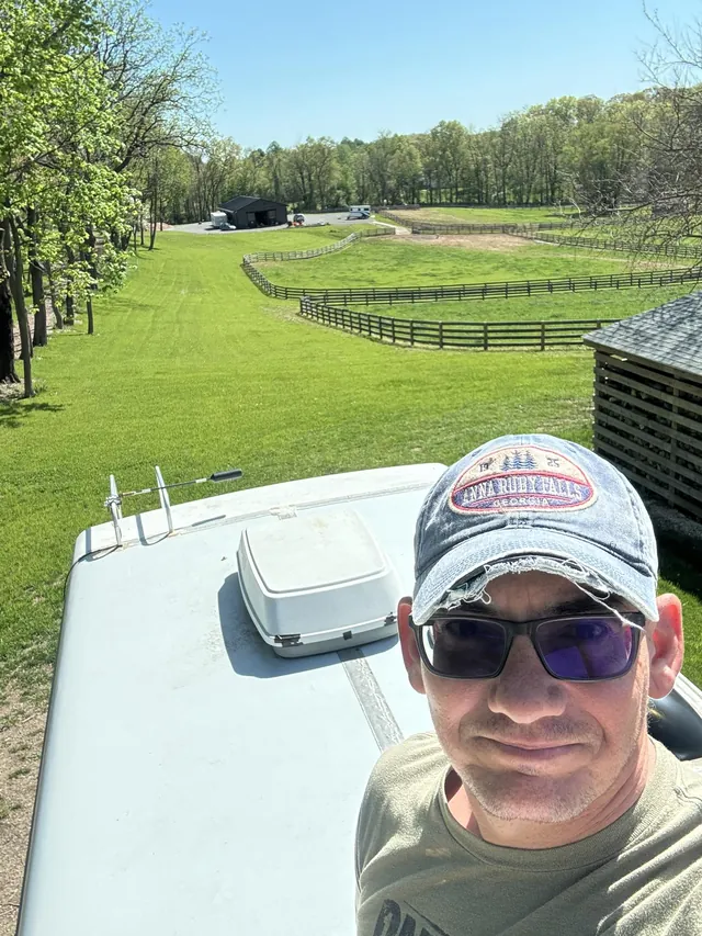 Brian Kaminski, owner of Wayfare Mobile RV Repair, on an RV roof during a mobile roof inspection in Harford County, Maryland.